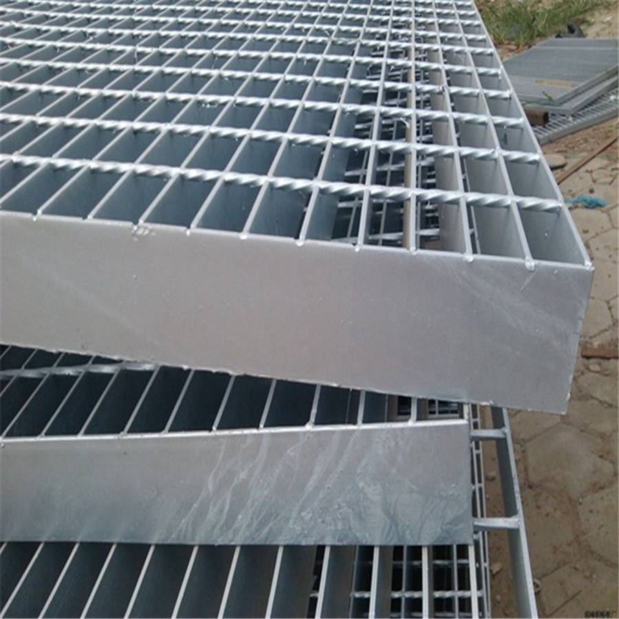 Carbon steel swage-locked grating